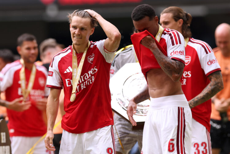 CARDIFF, WALES - AUGUST 16: Martin Odegaard and Gabriel of Arsenal celebrate following their team's victory in the 2026 FA Community Shield match b...