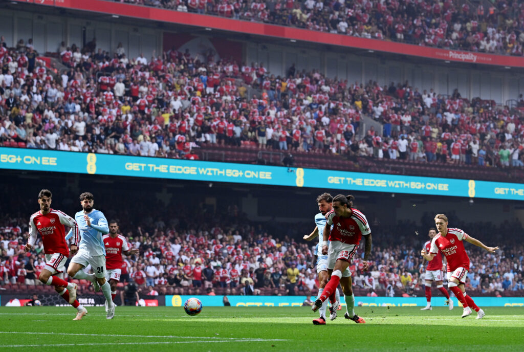 CARDIFF, WALES - AUGUST 16: Riccardo Calafiori of Arsenal scores his team’s first goal during the 2026 FA Community Shield match between Arsenal and Manchester City at Principality Stadium on August 16, 2026 in Cardiff, Wales. (Photo by Shaun Botterill/Getty Images)