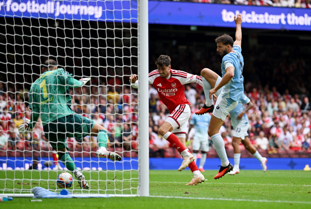 CARDIFF, WALES - AUGUST 16: Kai Havertz of Arsenal scores his team's second goal past Gianluigi Donnarumma of Manchester City during the 2026 FA Community Shield match between Arsenal and Manchester City at Principality Stadium on August 16, 2026 in Cardiff, Wales. (Photo by Shaun Botterill/Getty Images)