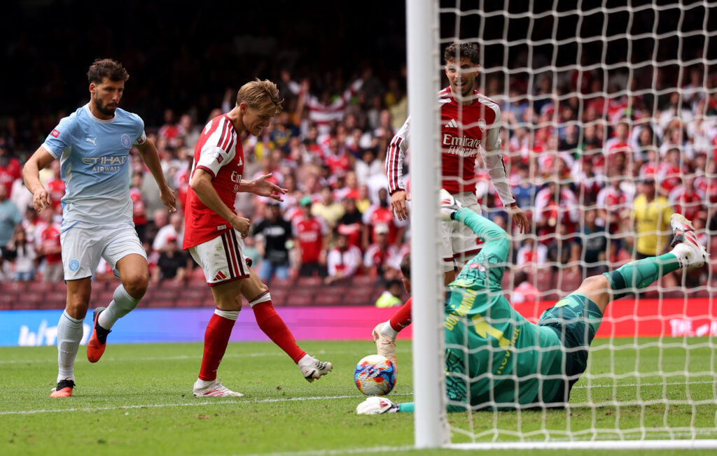 CARDIFF, WALES - AUGUST 16: Martin Odegaard of Arsenal scores his team's third goal during the 2026 FA Community Shield match between Arsenal and Manchester City at Principality Stadium on August 16, 2026 in Cardiff, Wales. (Photo by Carl Recine/Getty Images)