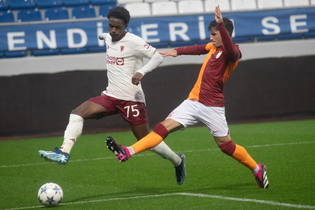 ISTANBUL, TURKEY - NOVEMBER 29: Habeeb Ogunneye of Manchester United is in action with Ali Yesilyurt of Galatasaray during the UEFA Youth League match between Galatasaray A.S. and Manchester United at  on November 29, 2023 in Istanbul, Turkey. (Photo by Burak Kara/Getty Images)