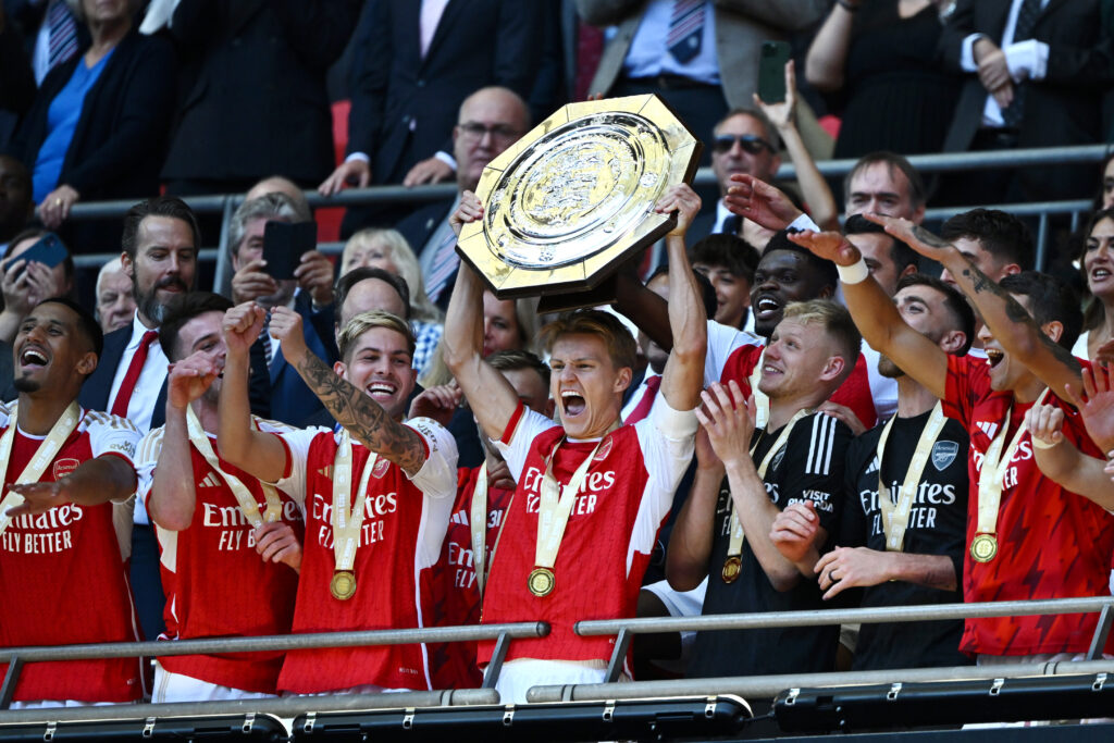 LONDON, ENGLAND - AUGUST 06: Martin Odegaard of Arsenal lifts the FA Community Shield following The FA Community Shield match between Manchester City against Arsenal at Wembley Stadium on August 06, 2023 in London, England. (Photo by Mike Hewitt/Getty Images)