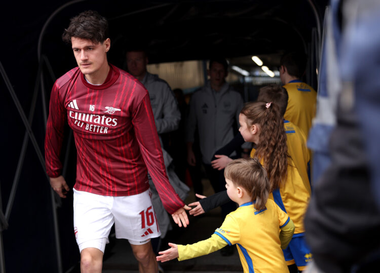 MANSFIELD, ENGLAND - MARCH 07: Christian Norgaard of Arsenal interacts with mascots as he enters the pitch to warm up prior to the Emirates FA Cup ...