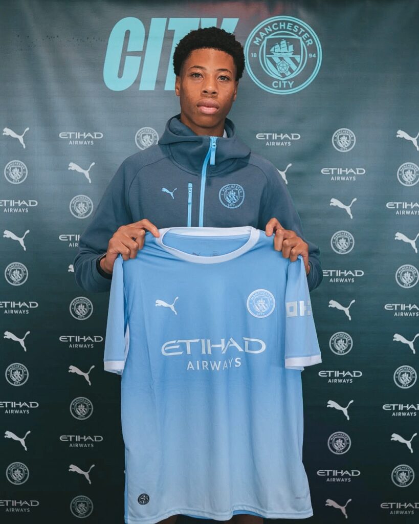 Mishel Nduka signing for Manchester City (Photo via Nduka on Instagram)