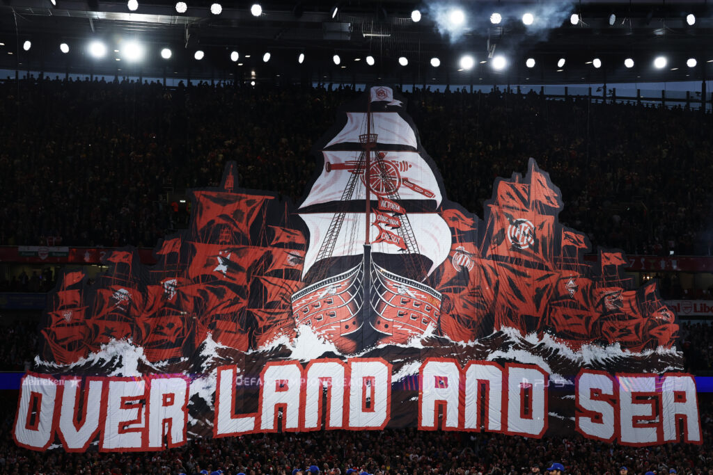 LONDON, ENGLAND - MAY 05: An Arsenal tifo depicting multiple ships with the text "Over Land And Sea" is displayed prior to the UEFA Champions League 2025/26 Semi Final Second Leg match between Arsenal FC and Atletico de Madrid at Arsenal Stadium on May 05, 2026 in London, England. (Photo by Justin Setterfield/Getty Images)