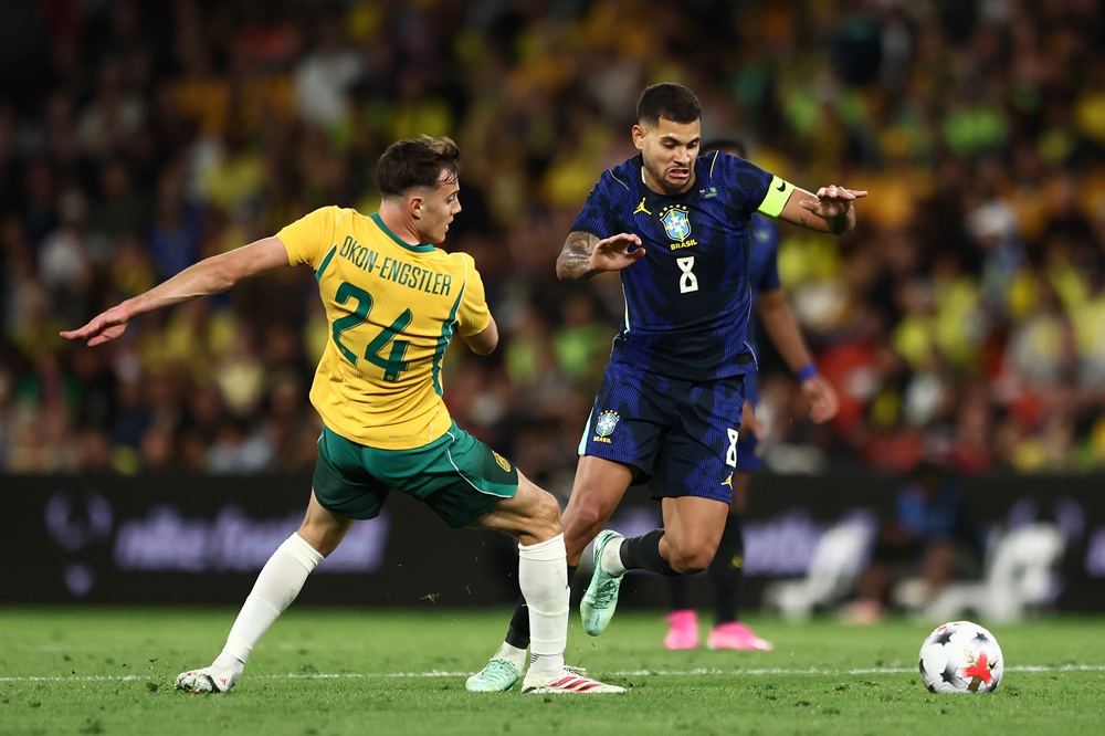 Bruno Guimaraes Rodriguez Moura of Brazil and Paul Okon-Engstler of Australia battle for the ball during the international friendly match between Australia Socceroos and Brazil at Suncorp Stadium on September 29, 2026 in Brisbane, Australia. (Photo by Chris Hyde/Getty Images)