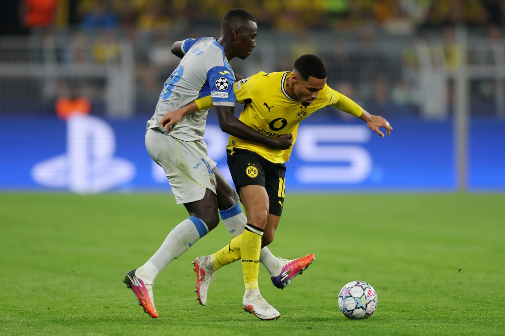 Ethan Nwaneri of Borussia Dortmund is challenged by Pape Gueye of Villarreal during the UEFA Champions League 2026/27 League Phase MD1 match between Borussia Dortmund and Villarreal CF at BVB Stadion Dortmund on September 08, 2026 in Dortmund, Germany. (Photo by Lars Baron/Getty Images)