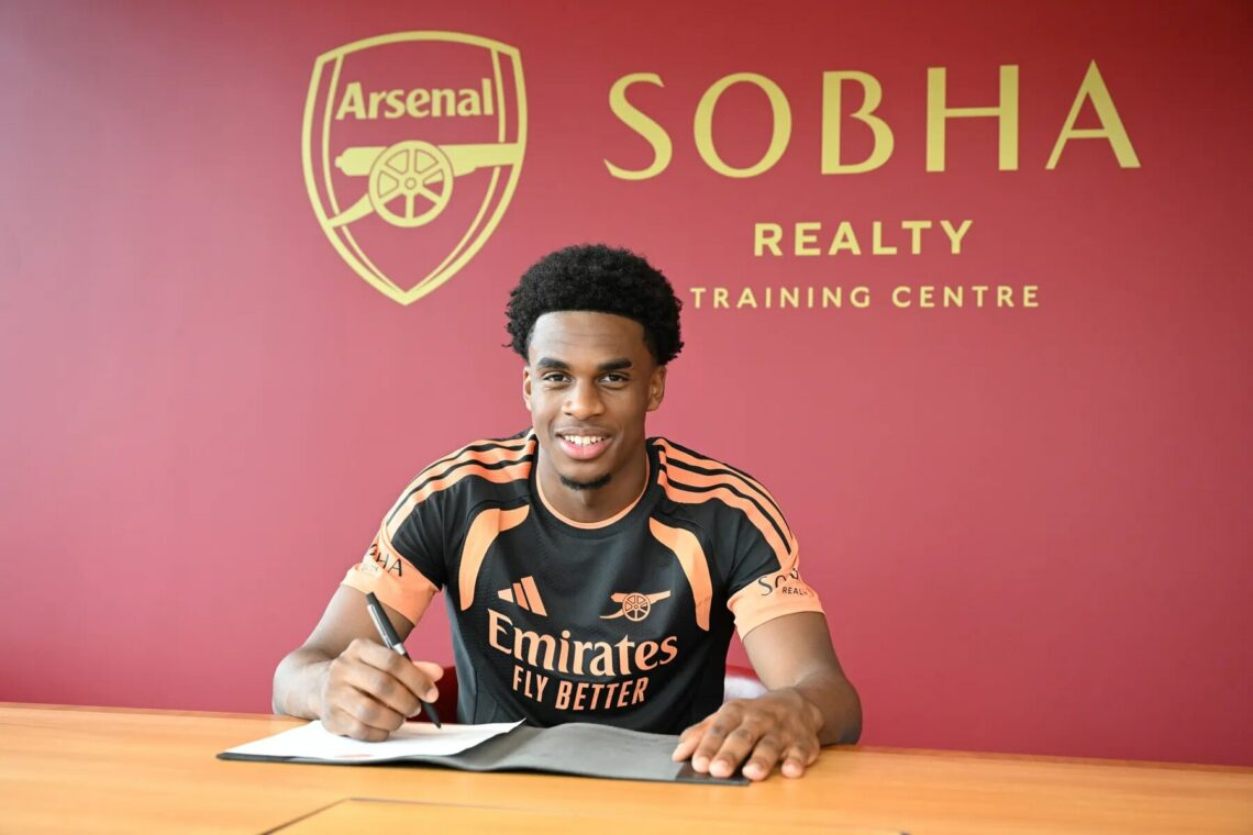 Vincent Joseph signing for Arsenal (Photo via Arsenal.com)