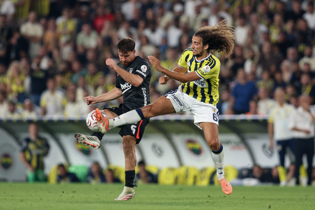 Salih Ozcan of Besiktas is challenged by Mattéo Guendouzi of Fenerbahce during the Turkish Super League 2026/27 match between Fenerbahce SK and Besiktas JK at Ulker Sukru Saracoglu Stadium on September 5, 2026 in Istanbul, Turkey. (Photo by Ahmad Mora/Getty Images)