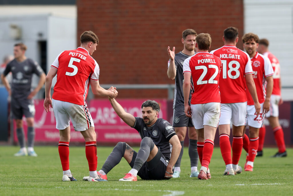 FLEETWOOD, ENGLAND - MAY 02: Callum Paterson of Milton Keynes Dons is consoled by Finley Potter of Fleetwood Town after Milton Keynes Dons finished runners up in Sky Bet League Two following the Sky Bet League Two match between Fleetwood Town and Milton Keynes Dons at Highbury Stadium on May 02, 2026 in Fleetwood, England. (Photo by Matt McNulty/Getty Images)
