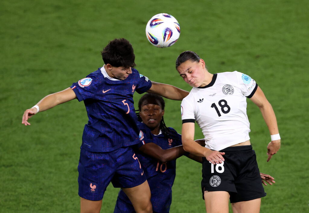 BASEL, SWITZERLAND - JULY 19: Elisa De Almeida, Oriane Jean-Francois of France competes for a header with Giovanna Hoffmann of Germany during the UEFA Women's EURO 2025 Quarter-Final match between France and Germany at St. Jakob-Park on July 19, 2025 in Basel, Switzerland. (Photo by Charlotte Wilson/Getty Images)