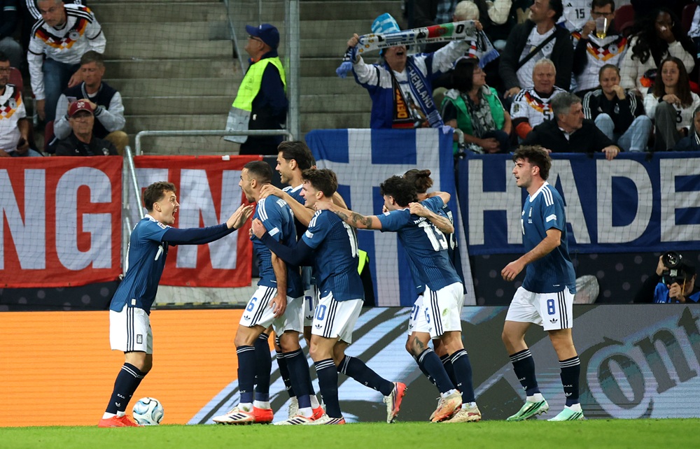 Dimitris Kourbelis of Greece celebrates scoring his team’s first goal with teammates during the UEFA Nations League 2026/27 group phase match between Germany and Greece at WWK Arena on September 27, 2026 in Augsburg, Germany. (Photo by Alex Grimm/Getty Images)