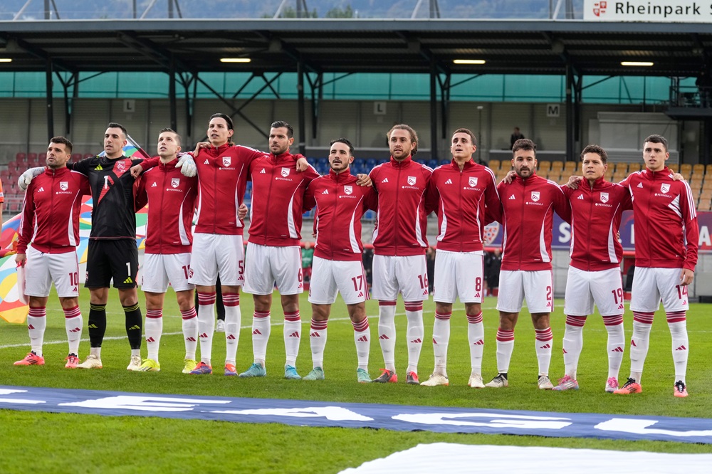 Liam Walker, Bradley Banda, Jayce Olivero, Louie Annesley, Bernardo Lopes, Kian Ronan, Daniel Bent, Nicholas Pozo, Ethan Jolley, Andre Tjay De Barr and James Scanlon of Gibraltar during the national anthem during the UEFA Nations League 2024/25 League D Group D1 match between Liechtenstein and Gibraltar at Rheinpark Stadion on October 13, 2024 in Vaduz, Liechtenstein. (Photo by Carsten Harz/Getty Images)