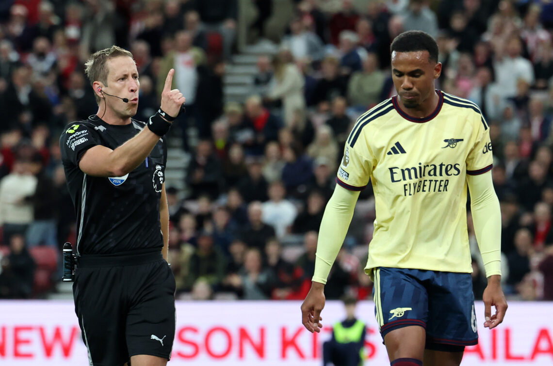 SUNDERLAND, ENGLAND - SEPTEMBER 12: Referee, John Brooks, forces Gabriel of Arsenal off the pitch after receiving medical treatment during the Prem...