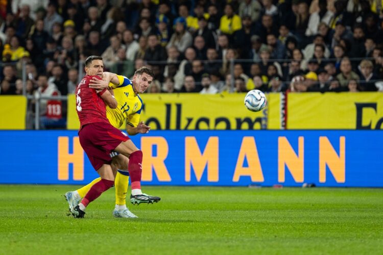 Jan Bednarek of Poland and Viktor Gyokeres of Sweden during the UEFA Nations League 2026/27 group phase match between Sweden and Poland at Strawber...