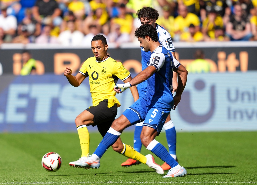 Ethan Nwaneri of Borussia Dortmund is challenged by Ozan Kabak of TSG 1899 Hoffenheim during the Bundesliga 2026/27 match between TSG Hoffenheim and Borussia Dortmund at SNP Arena on September 05, 2026 in Sinsheim, Germany. (Photo by Sona Maleterova/Getty Images)