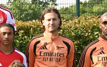 Former Arsenal player now coaching club's u15 side 1 Conor Henderson with the Arsenal u15s (Photo via Arsenal.com)