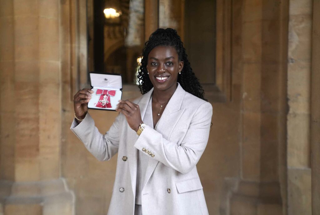 WINDSOR, ENGLAND - OCTOBER 7: Michelle Agyemang after being made a Member of the Order of the British Empire (MBE) at Windsor Castle on October 7, 2026 in Windsor, England. (Photo by Andrew Matthews - Pool/Getty Images)