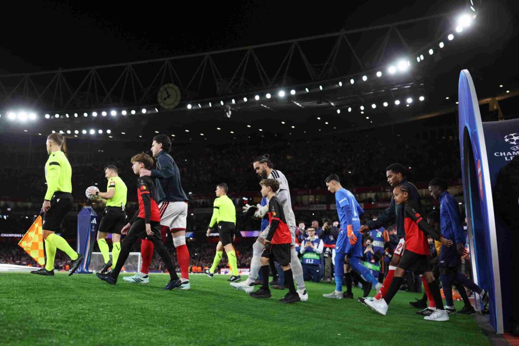 LONDON, ENGLAND - OCTOBER 13: Declan Rice and David Raya of Arsenal walk out before the UEFA Champions League 2026/27 League Phase MD2 match between Arsenal FC and LOSC Lille at Arsenal Stadium on October 13, 2026 in London, England. (Photo by Julian Finney/Getty Images)