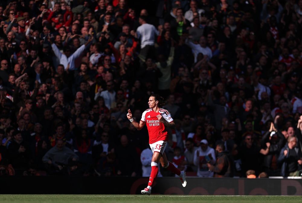 Riccardo Calafiori of Arsenal celebrates scoring his sides first goal during the Premier League 2026/27 match between Arsenal FC and Leeds United a...