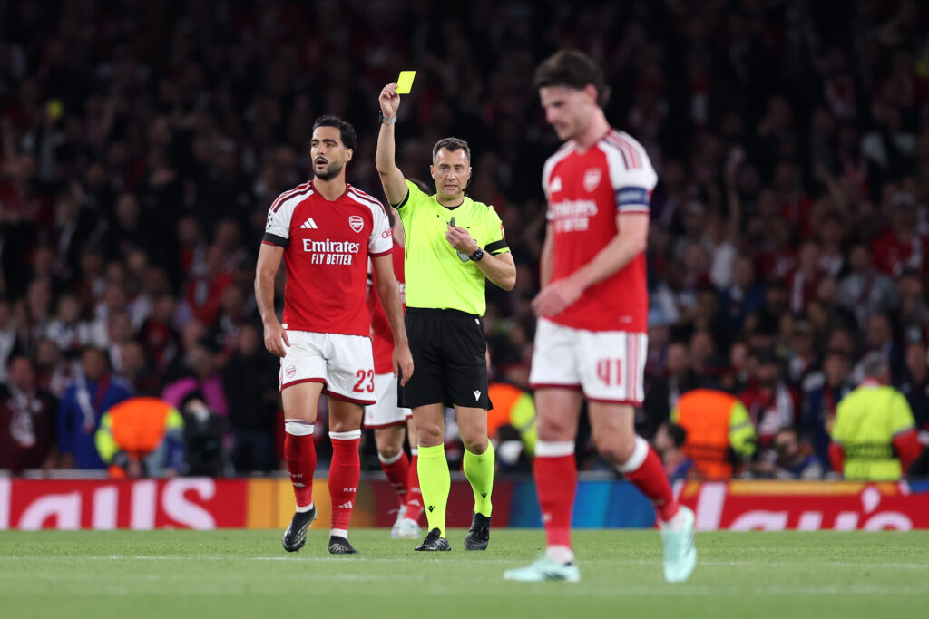 LONDON, ENGLAND - OCTOBER 13: Referee Felix Zwayer shows a yellow card to Mikel Merino of Arsenal during the UEFA Champions League 2026/27 League Phase MD2 match between Arsenal FC and LOSC Lille at Arsenal Stadium on October 13, 2026 in London, England. (Photo by Julian Finney/Getty Images)