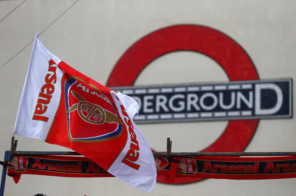 An Arsenal flag flies on a street stall outside the underground prior to the Barclays Premier League match between Arsenal and Crystal Palace at Emirates Stadium on August 16, 2014 in London, England. (Photo by Clive Mason/Getty Images)