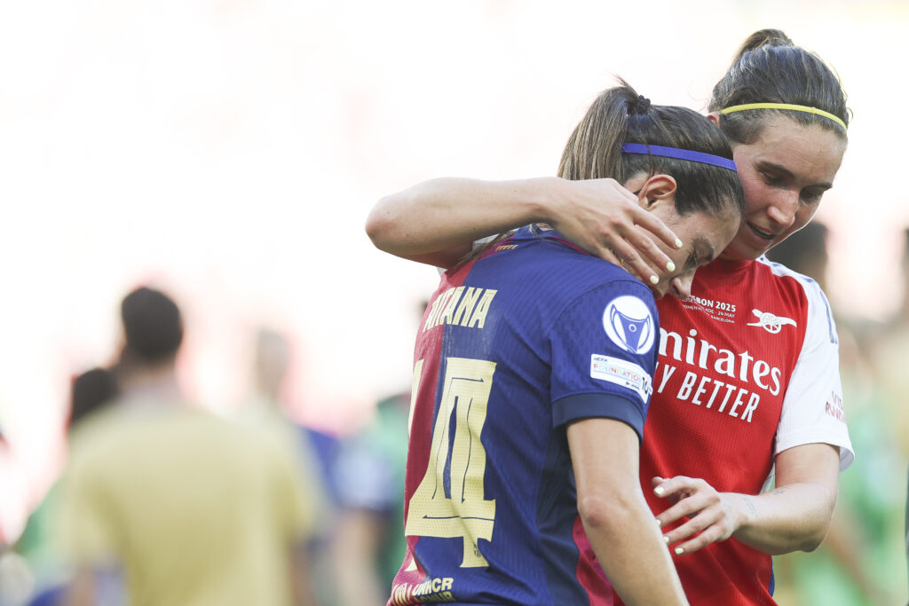 LISBON, PORTUGAL - MAY 24: Aitana Bonmati of FC Barcelona is consoled by Mariona Caldentey of Arsenal at full time in the UEFA Women's Champions League final match between Arsenal WFC and FC Barcelona at Estadio Jose Alvalade on May 24, 2025 in Lisbon, Portugal. (Photo by Maja Hitij/Getty Images)
