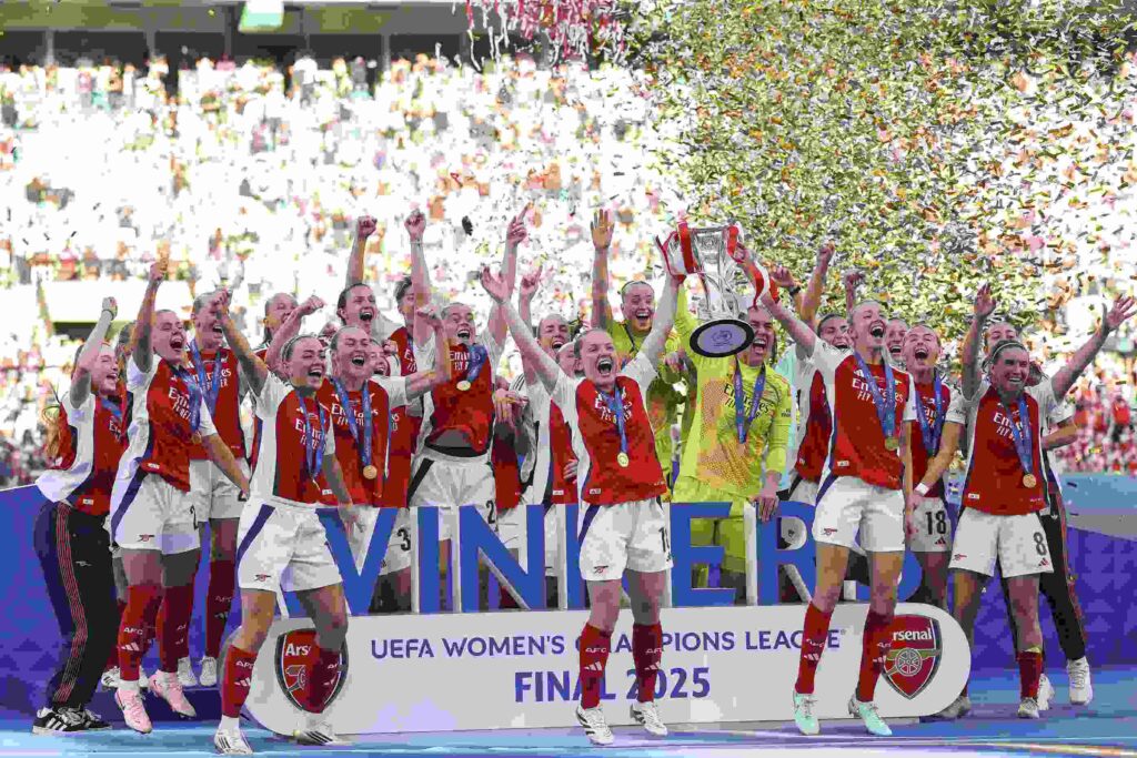 LISBON, PORTUGAL - MAY 24: Kim Little and Leah Williamson of Arsenal lift the UEFA Women's Champions League trophy after their team's victory in the UEFA Women's Champions League final match between Arsenal WFC and FC Barcelona at Estadio Jose Alvalade on May 24, 2025 in Lisbon, Portugal. (Photo by Maja Hitij/Getty Images)