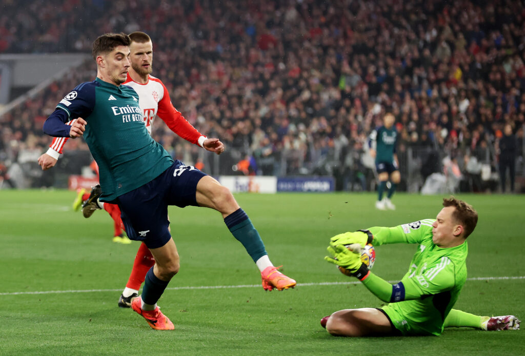 MUNICH, GERMANY - APRIL 17: Kai Havertz of Arsenal has a shot saved by Manuel Neuer of Bayern Munich during the UEFA Champions League quarter-final second leg match between FC Bayern München and Arsenal FC at Allianz Arena on April 17, 2024 in Munich, Germany. (Photo by Alex Grimm/Getty Images)