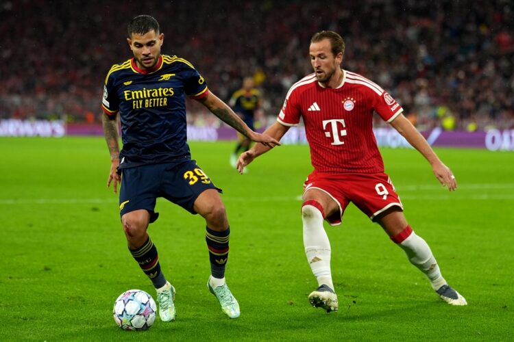 Bruno Guimaraes of Arsenal is challenged by Harry Kane of FC Bayern Munich during the UEFA Champions League 2026/27 League Phase MD3 match between ...