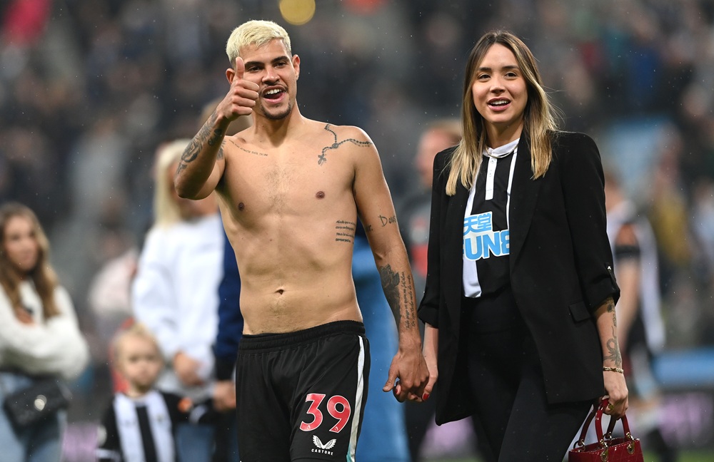 Newcastle player Bruno Guimaraes with his girlfriend Ana Lidia Martins on the pitch after the Premier League match between Newcastle United and Arsenal at St. James Park on May 16, 2022 in Newcastle upon Tyne, England. (Photo by Stu Forster/Getty Images)