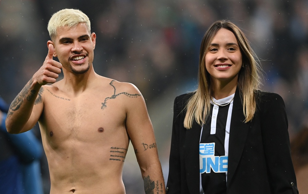 Newcastle player Bruno Guimaraes with his girlfriend Ana Lidia Martins on the pitch after the Premier League match between Newcastle United and Arsenal at St. James Park on May 16, 2022 in Newcastle upon Tyne, England. (Photo by Stu Forster/Getty Images)