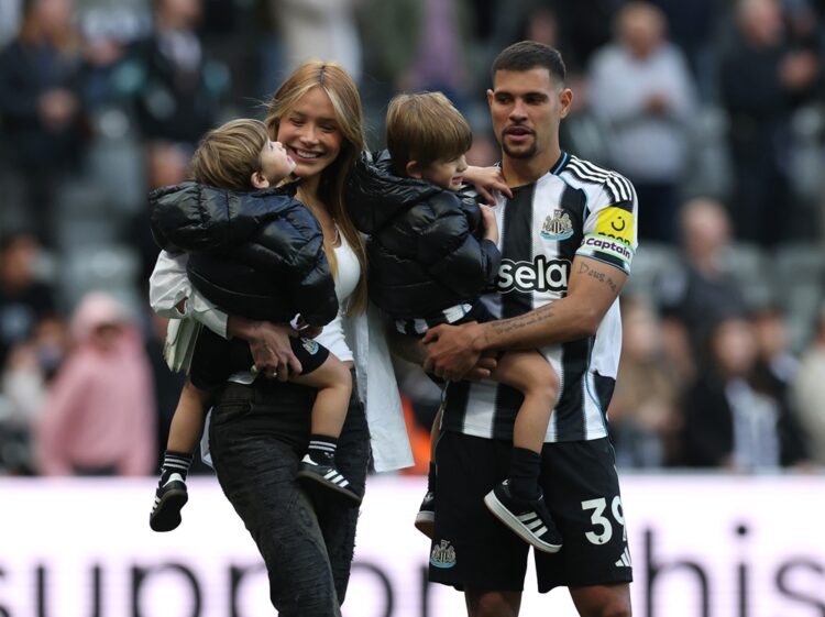 Bruno Guimaraes of Newcastle United celebrates victory with his wife and children after the Premier League match between Newcastle United and West ...