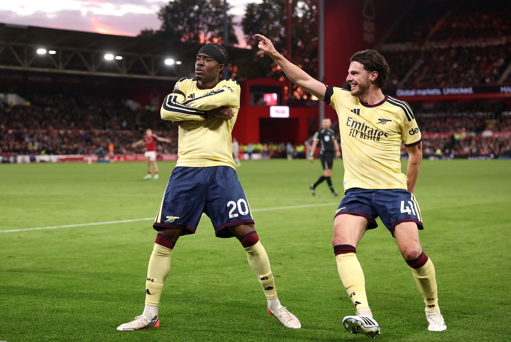 Noni Madueke of Arsenal celebrates scoring his team’s first goal with teammate Declan Rice during the Premier League 2026/27 match between Nottingham Forest FC and Arsenal FC at City Ground on October 18, 2026 in Nottingham, England. (Photo by Carl Recine/Getty Images)