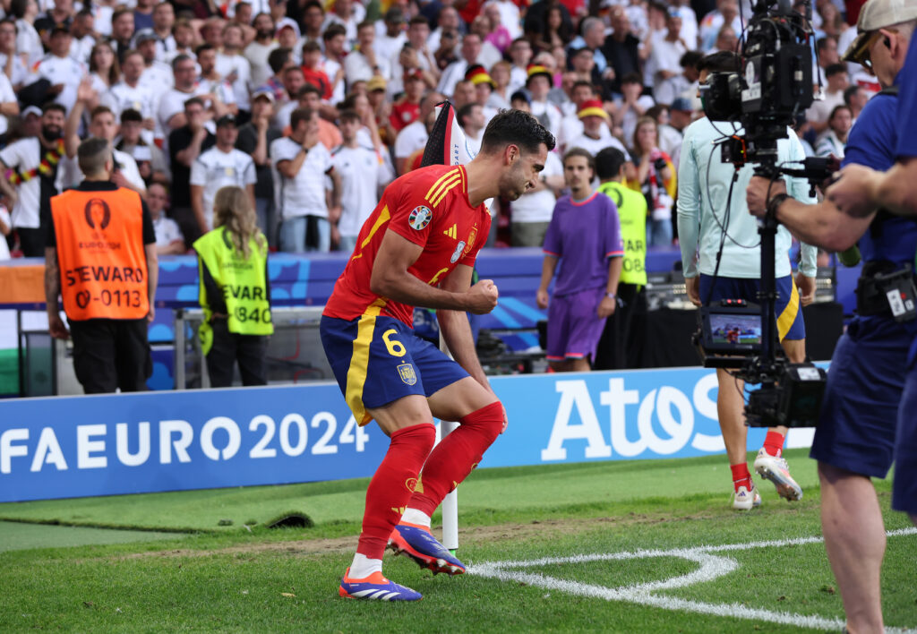 STUTTGART, GERMANY - JULY 05: Mikel Merino of Spain celebrates scoring his team's second goal by running around the corner flag to recreate a celebration his father, Angel Merino, did in the same stadium 33 years earlier during the UEFA EURO 2024 quarter-final match between Spain and Germany at Stuttgart Arena on July 05, 2024 in Stuttgart, Germany. (Photo by Alex Livesey/Getty Images)
