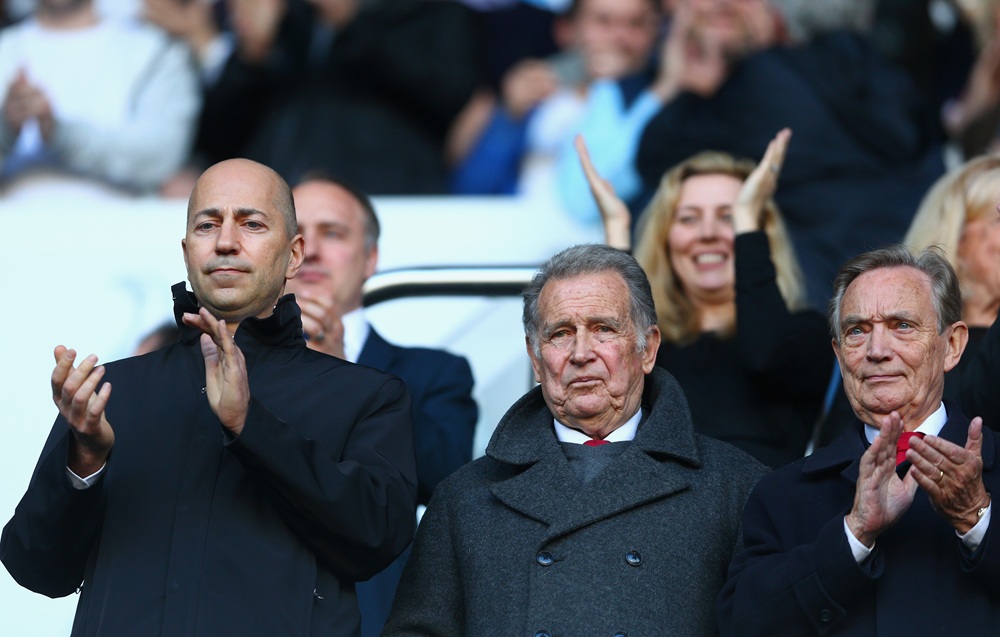 Arsenal CEO Ivan Gazidis (L) and Arsenal Director Ken Friar (R) applaud during the Barclays Premier League match between Tottenham Hotspur and Arsenal at White Hart Lane on March 16, 2014 in London, England.  (Photo by Paul Gilham/Getty Images)