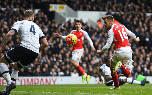 Aaron Ramsey of Arsenal scores his team's first goal during the Barclays Premier League match between Tottenham Hotspur and Arsenal at White Hart Lane on March 5, 2016 in London, England.