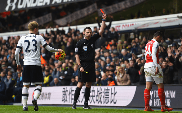 Francis Coquelin (R) of Arsenal is shown a red card by referee Michael Oliver (C) during the Barclays Premier League match between Tottenham Hotspur and Arsenal at White Hart Lane on March 5, 2016 in London, England. Credit: Shaun Botterill