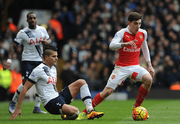 Hector Bellerin of Arsenal takes on Erik Lamela of Tottenham during the Barclays Premier League match between Tottenham Hotspur and Arsenal at White Hart Lane on March 5, 2016 in London, England. Credit: David Price