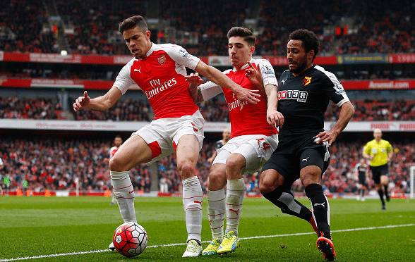Gabriel, Hector Bellerin of Arsenal compete for the ball against Ikechi Anya of Watford during the Barclays Premier League match between Arsenal and Watford at Emirates Stadium on April 2, 2016 in London, England. April 02, 2016| Credit: Julian Finney