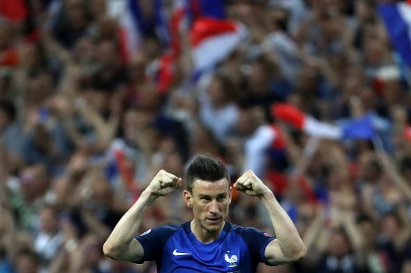 France's defender Laurent Koscielny celebrates after France beat Romania 2-1 in the opening match of the Euro 2016 group A football match between France and Romania at Stade de France, in Saint-Denis, north of Paris, on June 10, 2016. / AFP / KENZO TRIBOUILLARD (Photo credit should read KENZO TRIBOUILLARD/AFP/Getty Images)