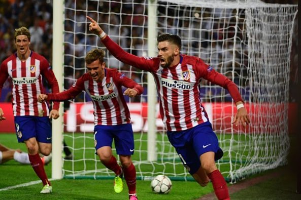 Atletico Madrid's Belgian forward Yannick Ferreira Carrasco (R) celebrates after scoring a goal next to Atletico Madrid's French forward Antoine Griezmann (C) and Atletico Madrid's Spanish forward Fernando Torres (L)  during the UEFA Champions League final football match between Real Madrid and Atletico Madrid at San Siro Stadium in Milan, on May 28, 2016. / AFP / PIERRE-PHILIPPE MARCOU 