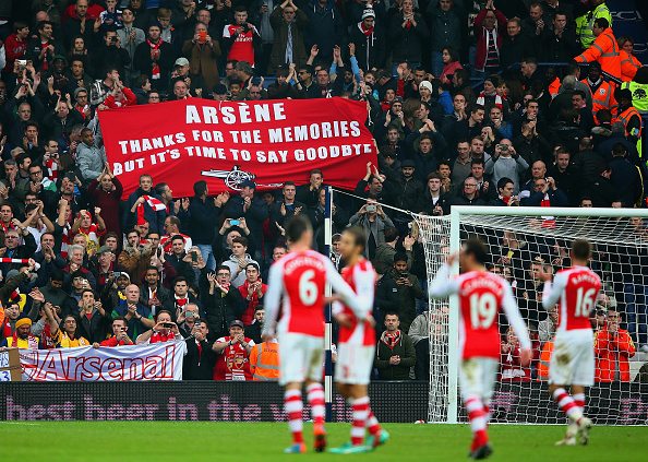 WEST BROMWICH, ENGLAND - NOVEMBER 29: Arsenal fans hold up a banner for Arsene Wenger, manager of Arsenal during the Barclays Premier League match between West Bromwich Albion and Arsenal at The Hawthorns on November 29, 2014 in West Bromwich, England (Photo by Mark Thompson/Getty Images)