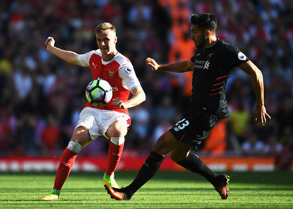LONDON, ENGLAND - AUGUST 14: Rob Holding of Arsenal is closed down by Emre Can of Liverpool during the Premier League match between Arsenal and Liverpool at Emirates Stadium on August 14, 2016 in London, England. (Photo by Mike Hewitt/Getty Images)