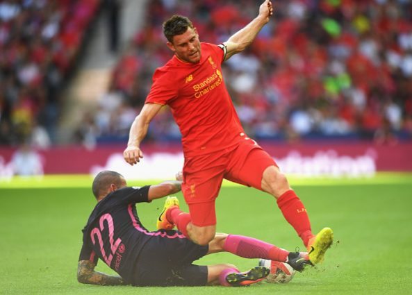LONDON, ENGLAND - AUGUST 06: James Milner of Liverpool is tackled by Aleix Vidal of Barcelona during the International Champions Cup match between Liverpool and Barcelona at Wembley Stadium on August 6, 2016 in London, England. (Photo by Michael Regan/Getty Images)