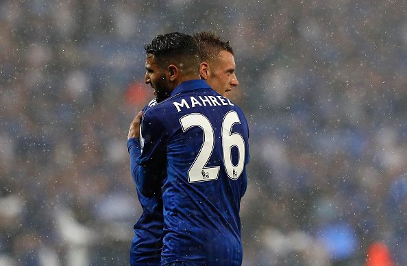 Leicester City's Algerian midfielder Riyad Mahrez (L) embraces Leicester City's English striker Jamie Vardy during the English Premier League football match between Leicester City and Everton at King Power Stadium in Leicester, central England on May 7, 2016. / AFP / ADRIAN DENNIS / RESTRICTED TO EDITORIAL USE. No use with unauthorized audio, video, data, fixture lists, club/league logos or 'live' services. Online in-match use limited to 75 images, no video emulation. No use in betting, games or single club/league/player publications. / (Photo credit should read ADRIAN DENNIS/AFP/Getty Images)