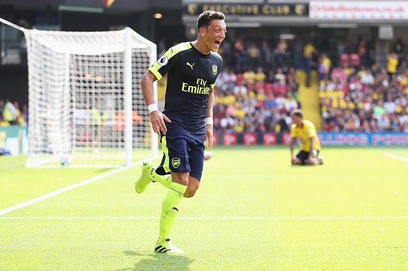 WATFORD, ENGLAND - AUGUST 27: Mesut Ozil of Arsenal scores his sides third goal during the Premier League match between Watford and Arsenal at Vicarage Road on August 27, 2016 in Watford, England. (Photo by Christopher Lee/Getty Images)