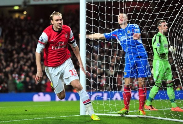 Arsenal's Danish striker Nicklas Bendtner celebrates scoring the opening goal of the English Premier League football match between Arsenal and Hull City at The Emirates Stadium in north London on December 4, 2013. AFP PHOTO/GLYN KIRK RESTRICTED TO EDITORIAL USE. NO USE WITH UNAUTHORIZED AUDIO, VIDEO, DATA, FIXTURE LISTS, CLUB/LEAGUE LOGOS OR LIVE SERVICES. ONLINE IN-MATCH USE LIMITED TO 45 IMAGES, NO VIDEO EMULATION. NO USE IN BETTING, GAMES OR SINGLE CLUB/LEAGUE/PLAYER PUBLICATIONS. (Photo credit should read GLYN KIRK/AFP/Getty Images)