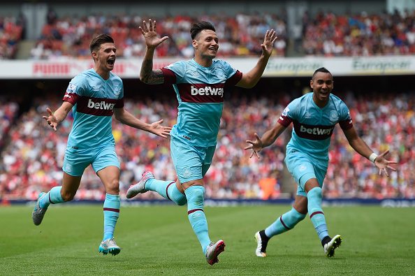 LONDON, ENGLAND - AUGUST 09: Mauro Zarate of West Ham United (C) celebrates with team mates as he scores their second goal during the Barclays Premier League match between Arsenal and West Ham United at the Emirates Stadium on August 9, 2015 in London, England. (Photo by Mike Hewitt/Getty Images)