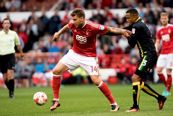 NOTTINGHAM, ENGLAND - SEPTEMBER 17: Nicklas Bendtner of Nottingham Forest and Martin Olsson of Norwich in action during the Sky Bet Championship match between Nottingham Forest and Norwich City on September 17, 2016 in Nottingham, England. (Photo by Nathan Stirk/Getty Images)
